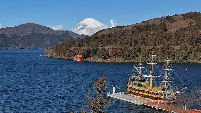 Mount Fuji and Lake Ashi with a historic pirate ship in Hakone, Japan.