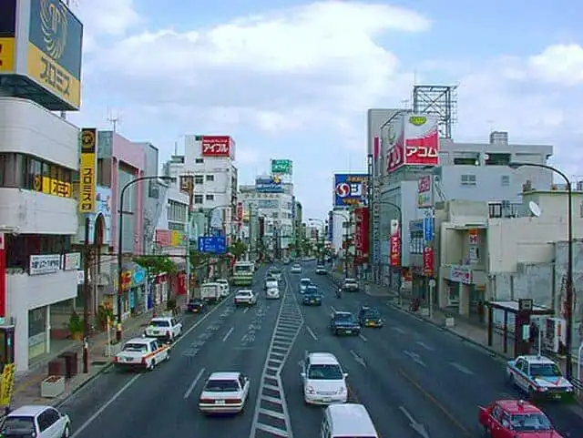 Tokyo street scene with shops and cars in Japan.